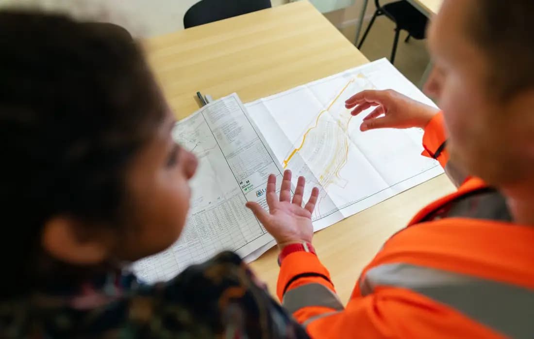 Engineers reviewing blueprints for BOQ software and construction costing in UAE